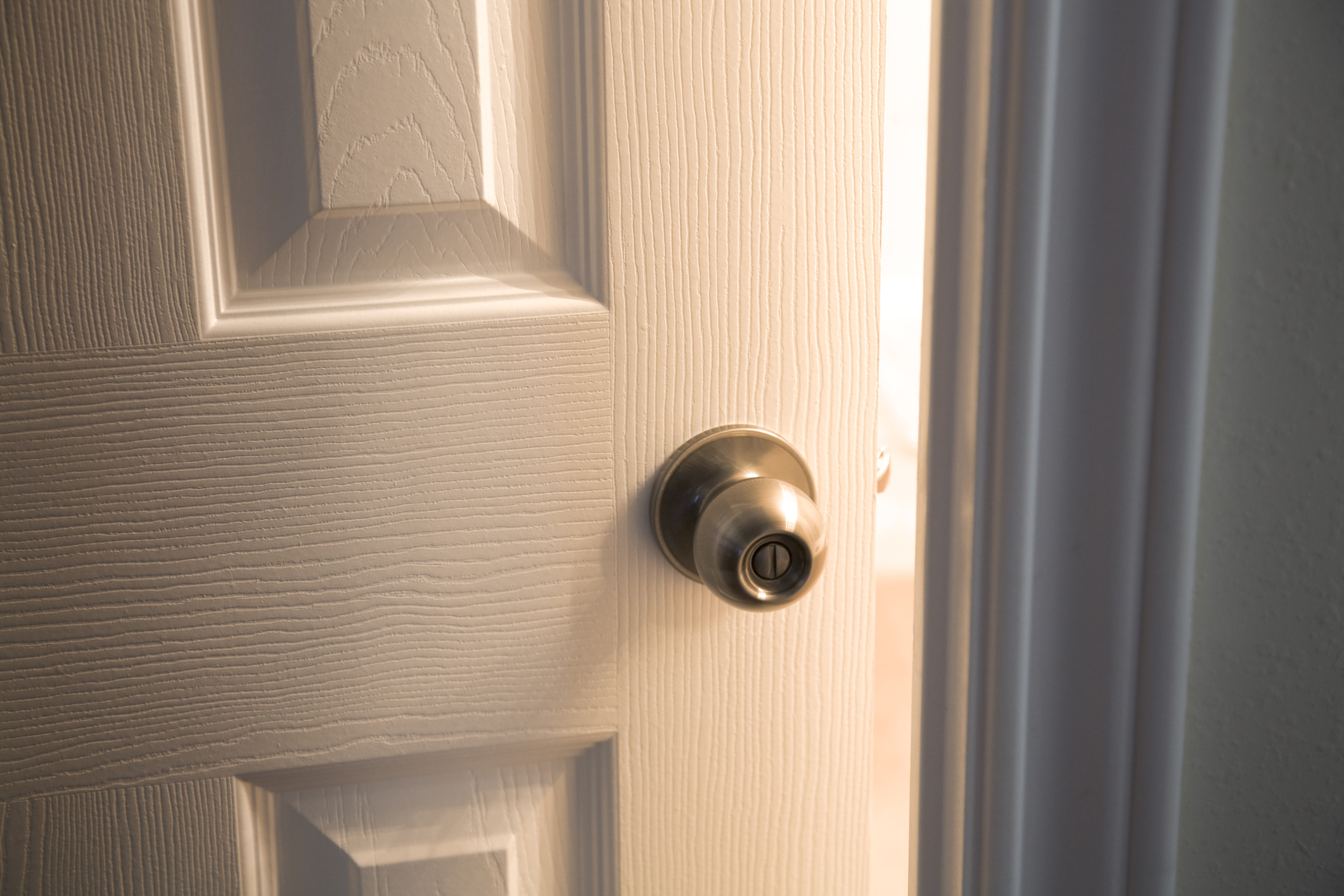 Close up image of open door with handle